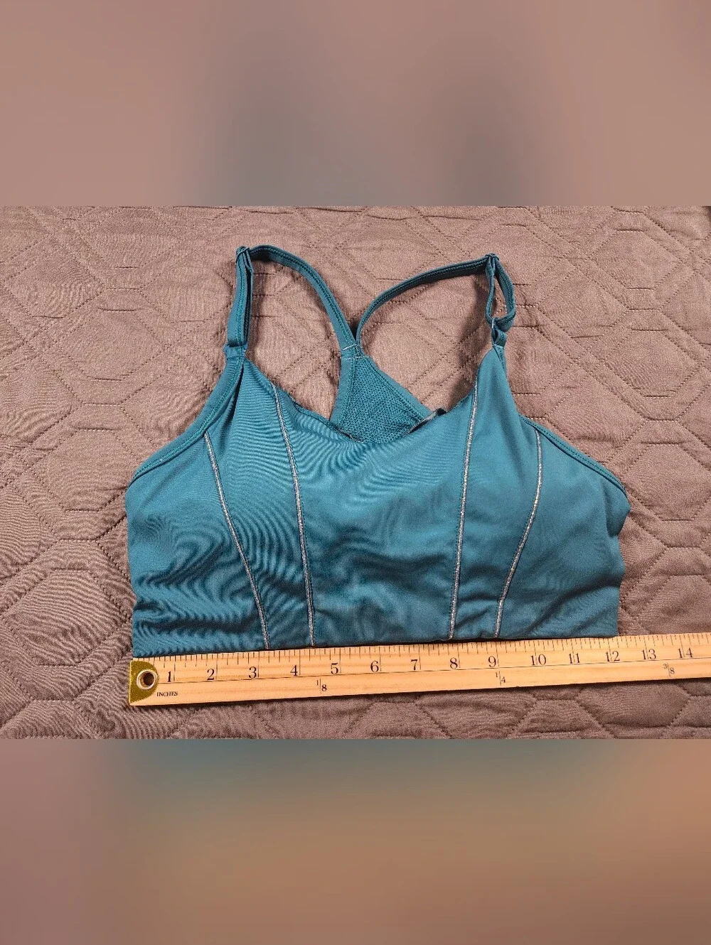 teal Nike Dri-FIT Indy light-support sports bra sparkling metallic tape accents